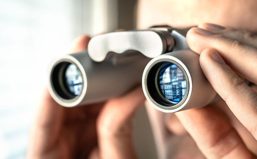 Man looking through binoculars