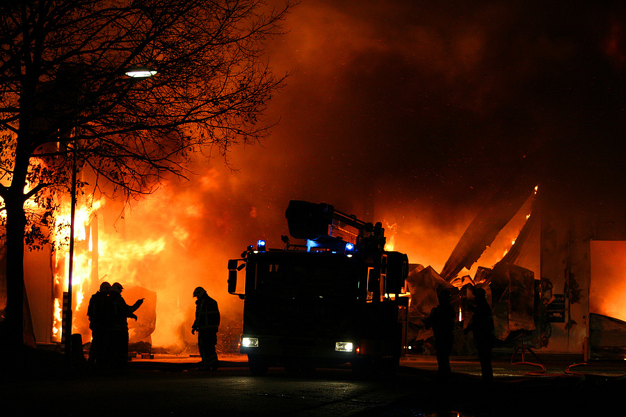 Fire fighters working to contain a church fire