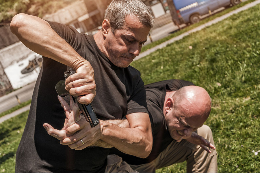 Kapap instructor demonstrates self defense techniques against a gun