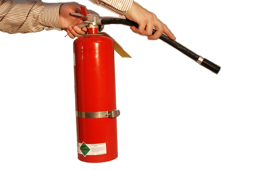 fire extinguishers Man holding a fire extinguisher