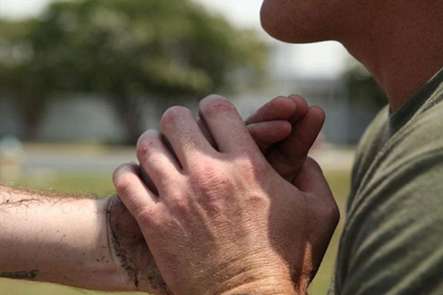 Man holding back a fist