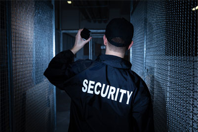 Security guard checking a hallway