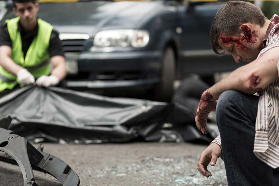 Injured man and a body bag