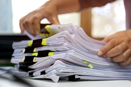 Stacks of Paper Files and Documents