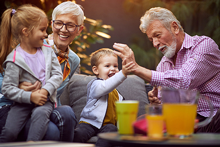 Cheerful grandchildren spending time with their grandparents